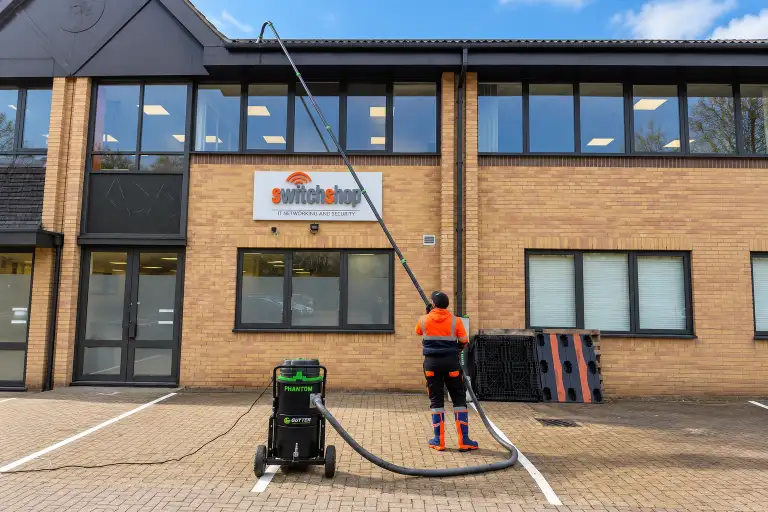 Professional gutter cleaning using specialist equipment