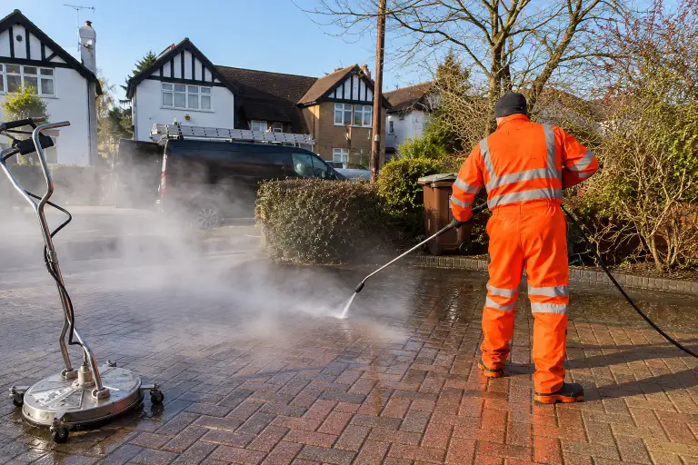 Professional pressure washing of an exterior surface